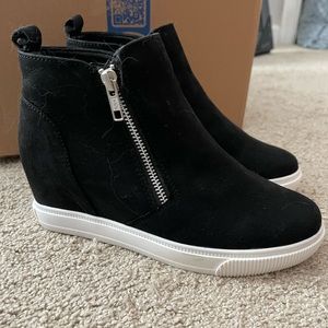 Black platform sneakers.